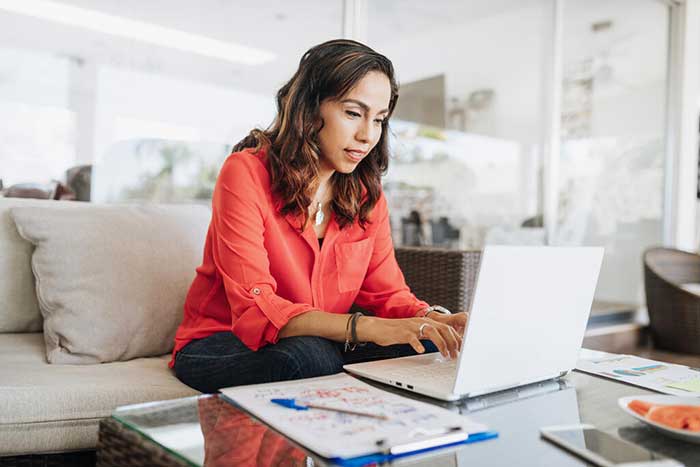 Businesswoman Working From Home 700 x 467