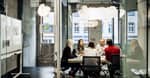 young people talking around a table s