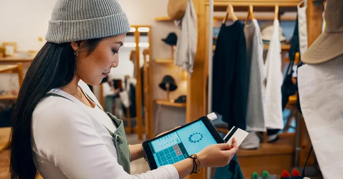 Shop Clerk Taking Mobile Credit Card Payment 1200x627