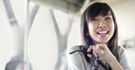 Businesswoman Holds Eyeglass Laughs In Office 560x292