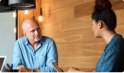 Two men discussing an issue in an office.