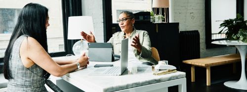 Financial Advisor In Discussion With Client 753x282