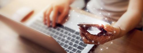 Woman Using Mobile Phone And Laptop 753x282