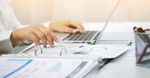 Businessman Planning In Office Using Laptop meta 560x292