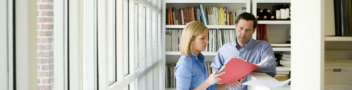 Business people discussing file