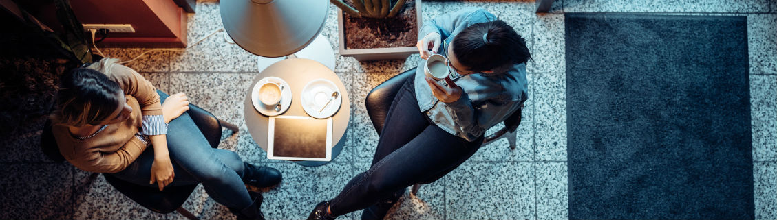 Two women talking at coffee shop