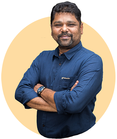 Girish Mathrubootham headshot orange