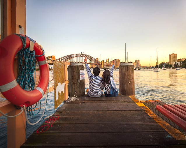 Private banking technology executive - two people on waterfront dock