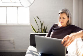 Woman Using Laptop While At Home. jpg 1024 px 13233