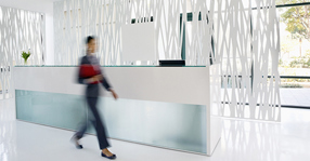 Businesswoman rushing through office lobby social meta 560 x 292