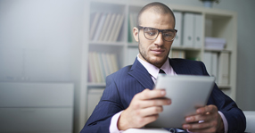 man reading report social meta 560x292